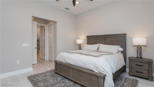 bedroom with baseboards, visible vents, and ceiling fan