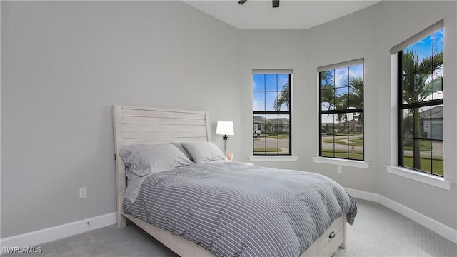 bedroom featuring carpet flooring and baseboards