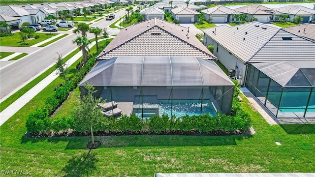 birds eye view of property with a residential view