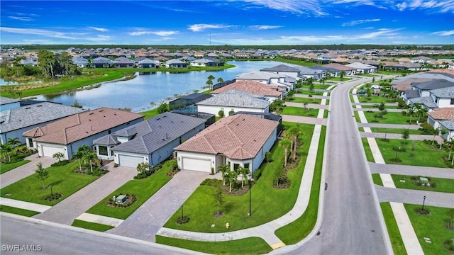 aerial view with a residential view and a water view