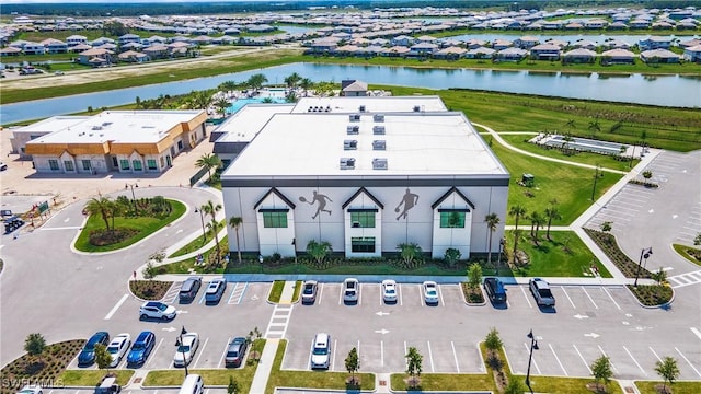 bird's eye view with a residential view and a water view