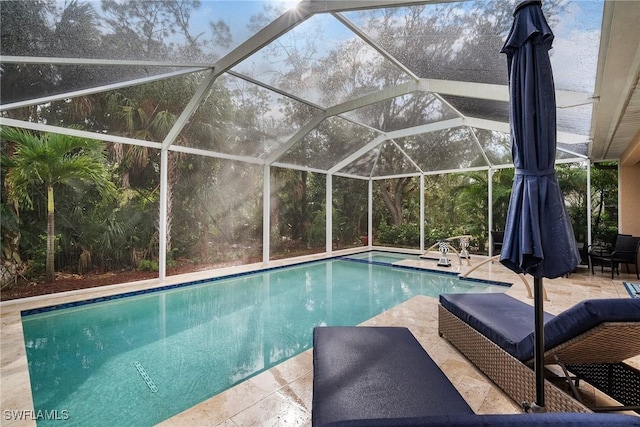 view of pool with a lanai and a patio