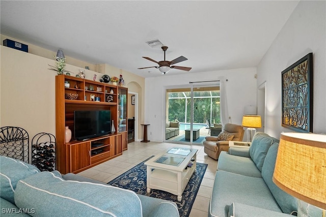 tiled living room featuring ceiling fan