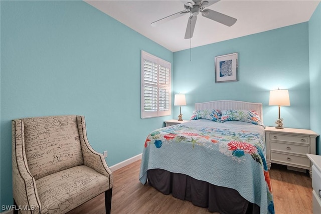 bedroom with ceiling fan and light wood-type flooring