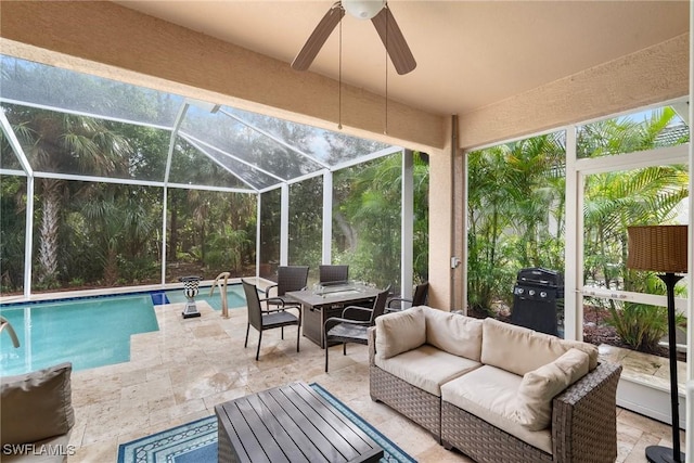 view of pool featuring ceiling fan, a lanai, a grill, an outdoor hangout area, and a patio