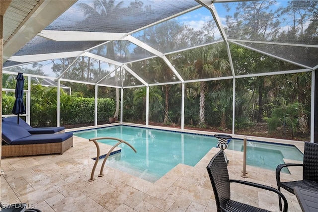 view of pool with a lanai and a patio area