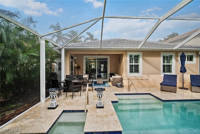 back of house featuring a patio and a lanai