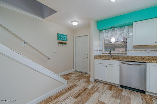 kitchen with white cabinets, dishwasher, pendant lighting, and sink