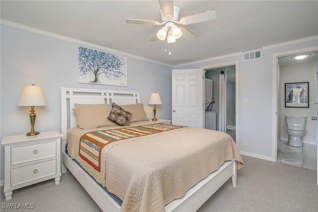 carpeted bedroom featuring ceiling fan, crown molding, and ensuite bathroom