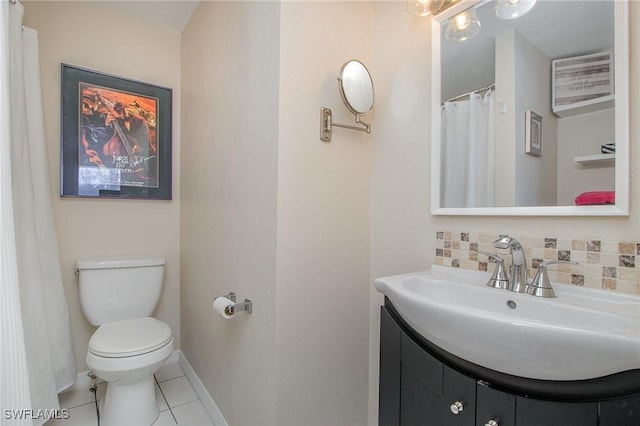 bathroom featuring decorative backsplash, tile patterned floors, vanity, and toilet