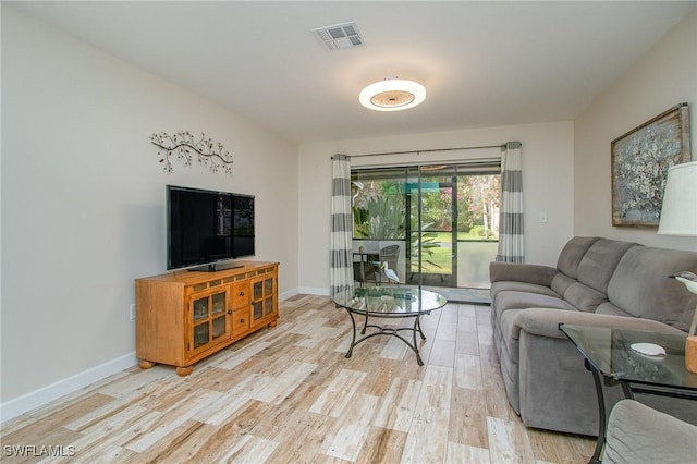 living room with light hardwood / wood-style floors