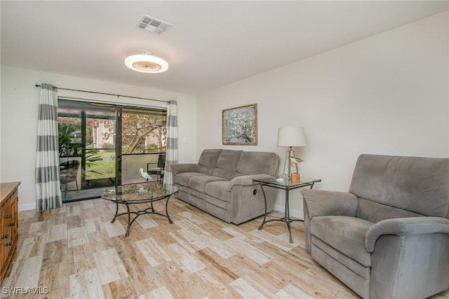 living room with light hardwood / wood-style floors