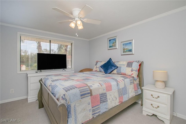 carpeted bedroom featuring ceiling fan and ornamental molding