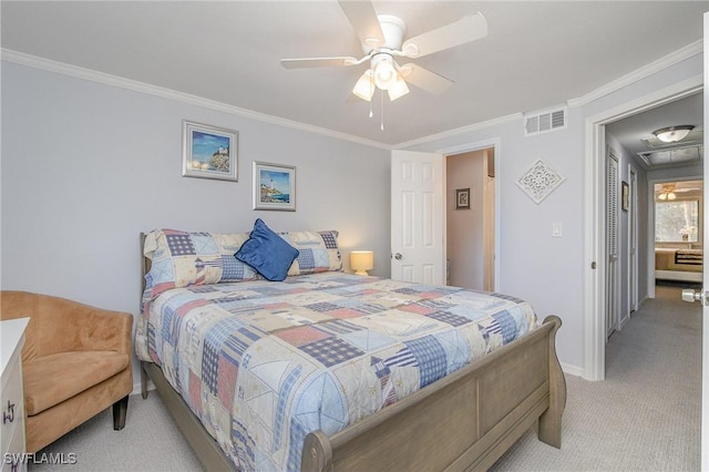 bedroom with ceiling fan, light colored carpet, and ornamental molding