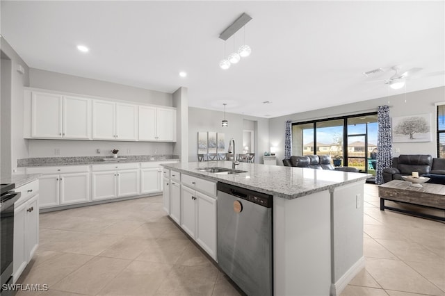 kitchen featuring white cabinetry, dishwasher, sink, hanging light fixtures, and an island with sink