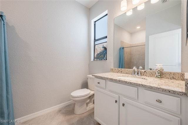 bathroom featuring curtained shower, tile patterned flooring, vanity, and toilet