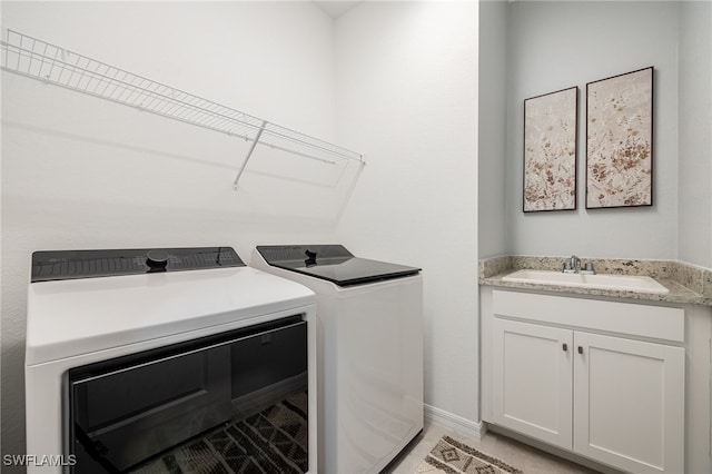 laundry area featuring ceiling fan, independent washer and dryer, and sink