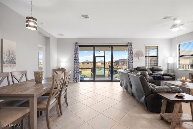 living room featuring ceiling fan and light tile patterned flooring