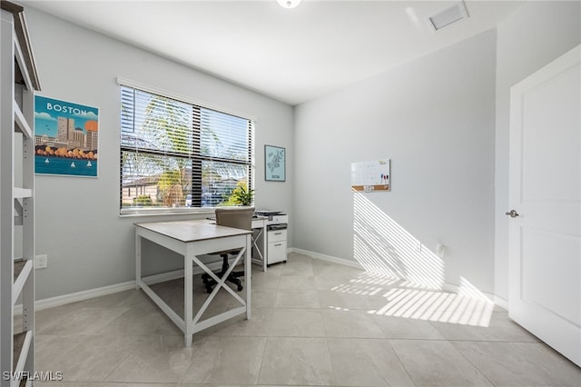 home office with light tile patterned flooring