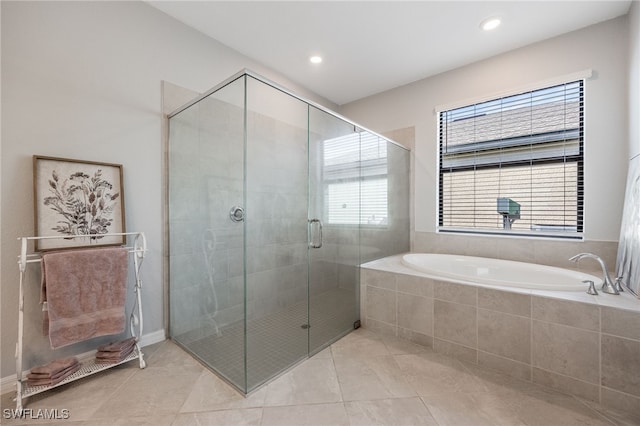 bathroom with tile patterned floors and plus walk in shower