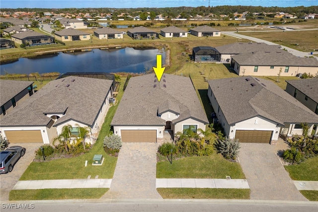 birds eye view of property with a water view