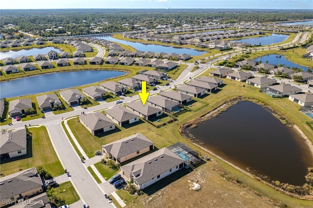 bird's eye view with a water view