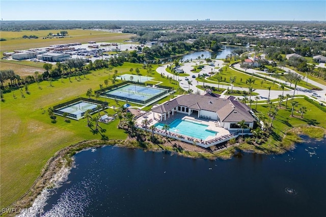 birds eye view of property with a water view