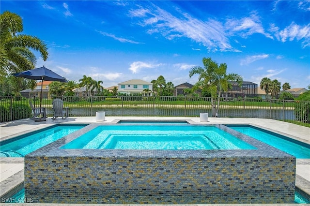 view of pool featuring an in ground hot tub, a water view, and fence