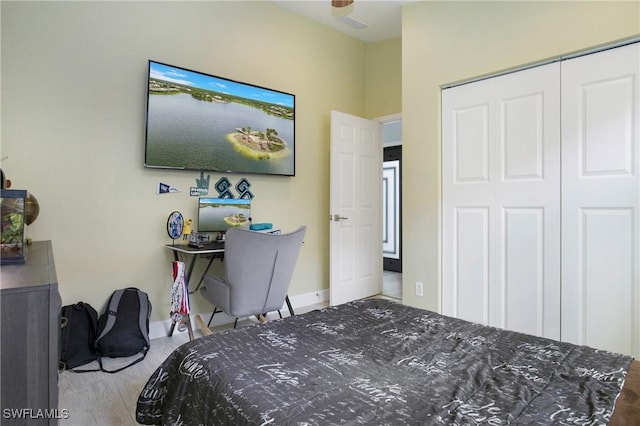 bedroom with a closet and baseboards