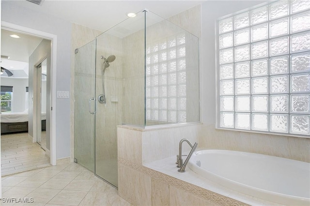 full bath featuring a stall shower, a ceiling fan, ensuite bath, tile patterned floors, and a garden tub