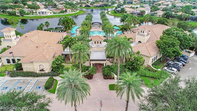 bird's eye view featuring a residential view and a water view