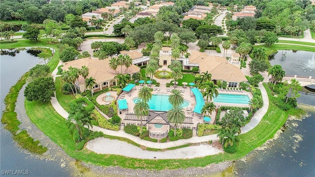 birds eye view of property with a water view