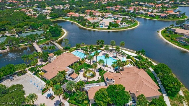 bird's eye view featuring a water view and a residential view