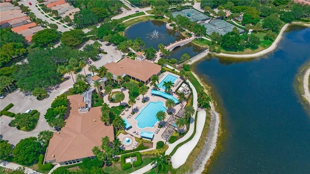 drone / aerial view with a water view and a residential view