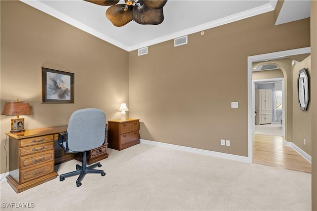 carpeted office with ceiling fan and crown molding