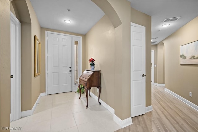 entryway with light hardwood / wood-style flooring