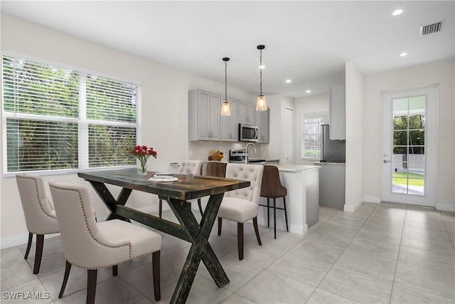 dining area featuring sink