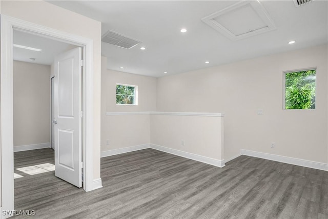 spare room with dark wood-type flooring