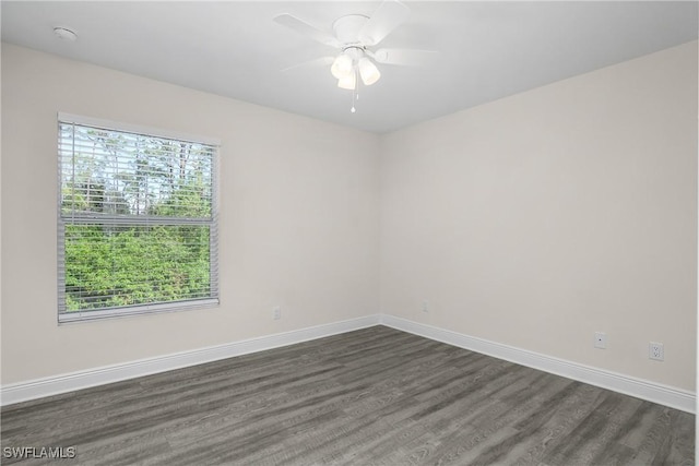 unfurnished room featuring dark hardwood / wood-style floors and ceiling fan