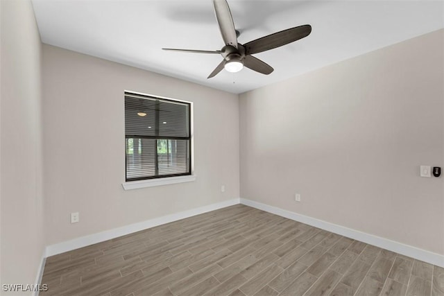 spare room featuring ceiling fan and light hardwood / wood-style flooring