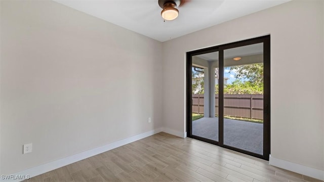 spare room with light hardwood / wood-style flooring