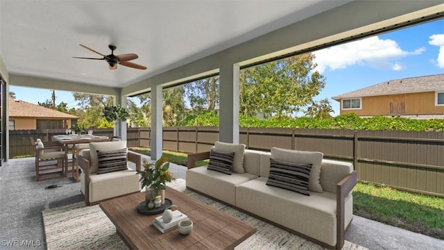 view of patio / terrace featuring ceiling fan, outdoor dining area, a fenced backyard, and an outdoor living space