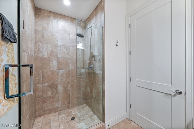 bathroom with a shower with shower door