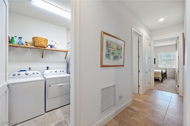 laundry room with washing machine and dryer