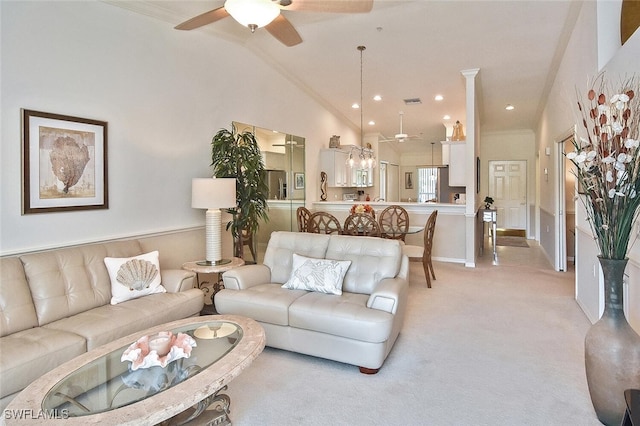 carpeted living room featuring ceiling fan, crown molding, and high vaulted ceiling