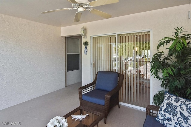 entrance to property with ceiling fan