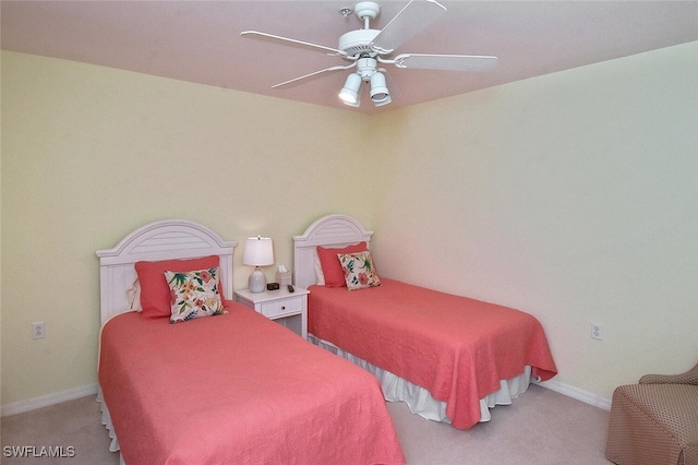 bedroom featuring light colored carpet and ceiling fan