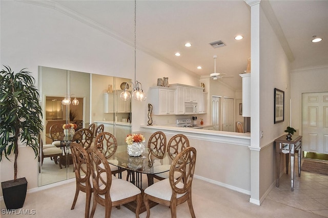 dining area with light tile patterned floors, ceiling fan with notable chandelier, high vaulted ceiling, and ornamental molding