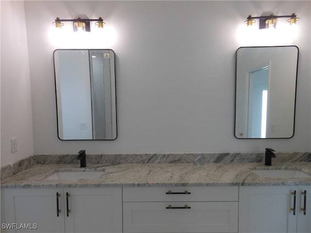 bathroom with double vanity and a sink