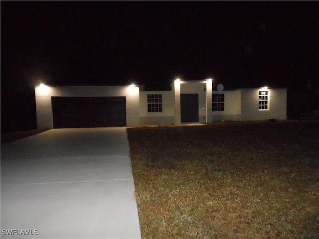 view of front of property with a garage